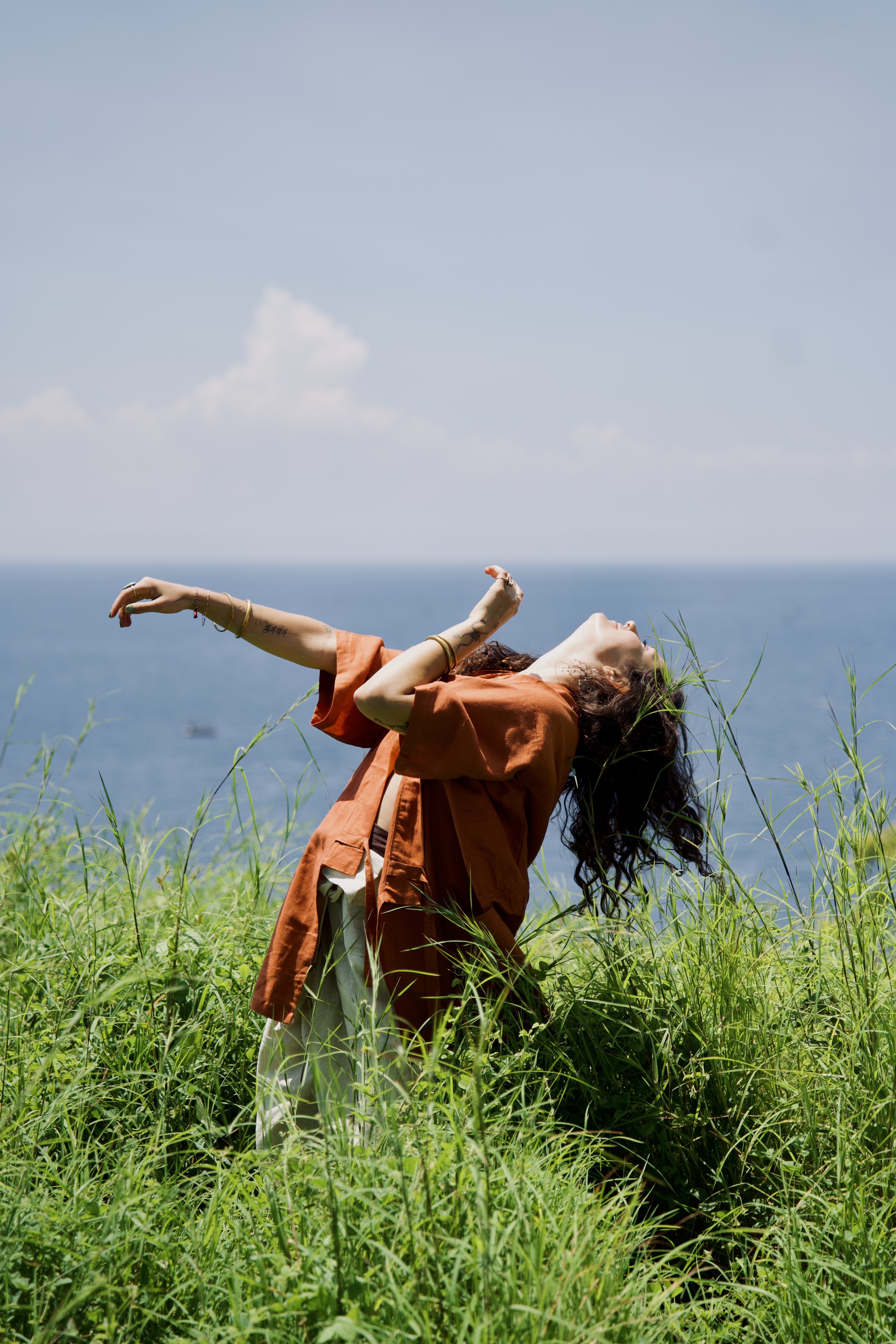 Quincee dancing in front of a mural