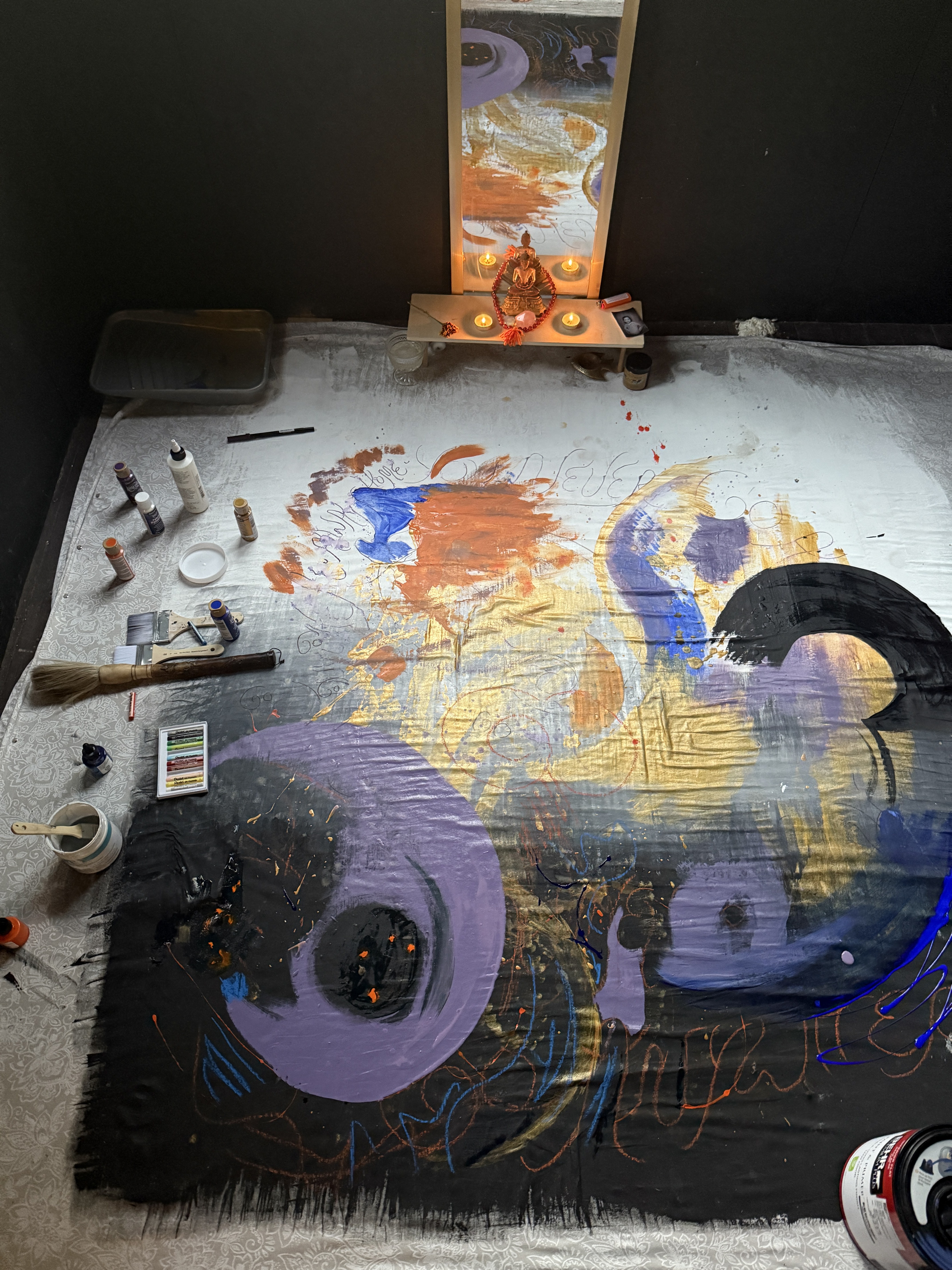 Large floor canvas with candles and paint